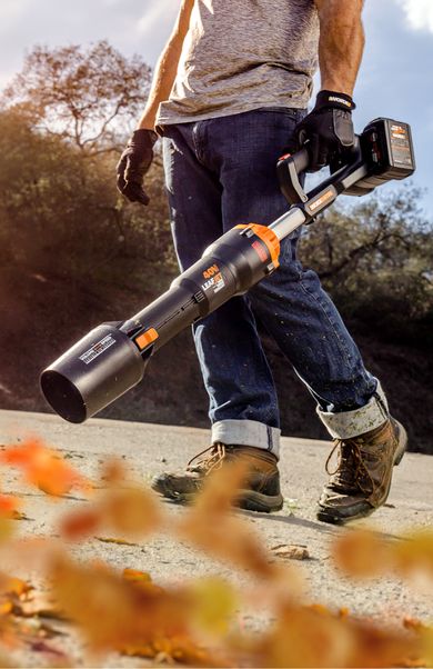 A person with their hand in front of the WorxNitro Leaf Blower feeling the powerful gust of wind.